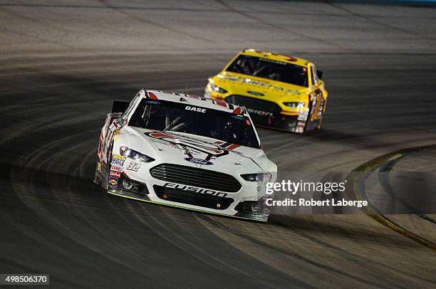 Joey Gase, driver of the R Factor 2 Ford, races during the NASCAR Sprint Cup Series Quicken Loans Race for Heroes 500 at Phoenix International...