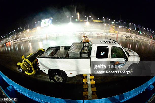 Jet dryers work during the NASCAR Sprint Cup Series Quicken Loans Race for Heroes 500 at Phoenix International Raceway on November 15, 2015 in...