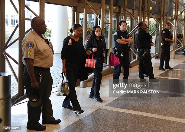 Police keep watch over passengers at Los Angeles International Airport after the U.S. State Department issued a worldwide travel alert warning U.S....