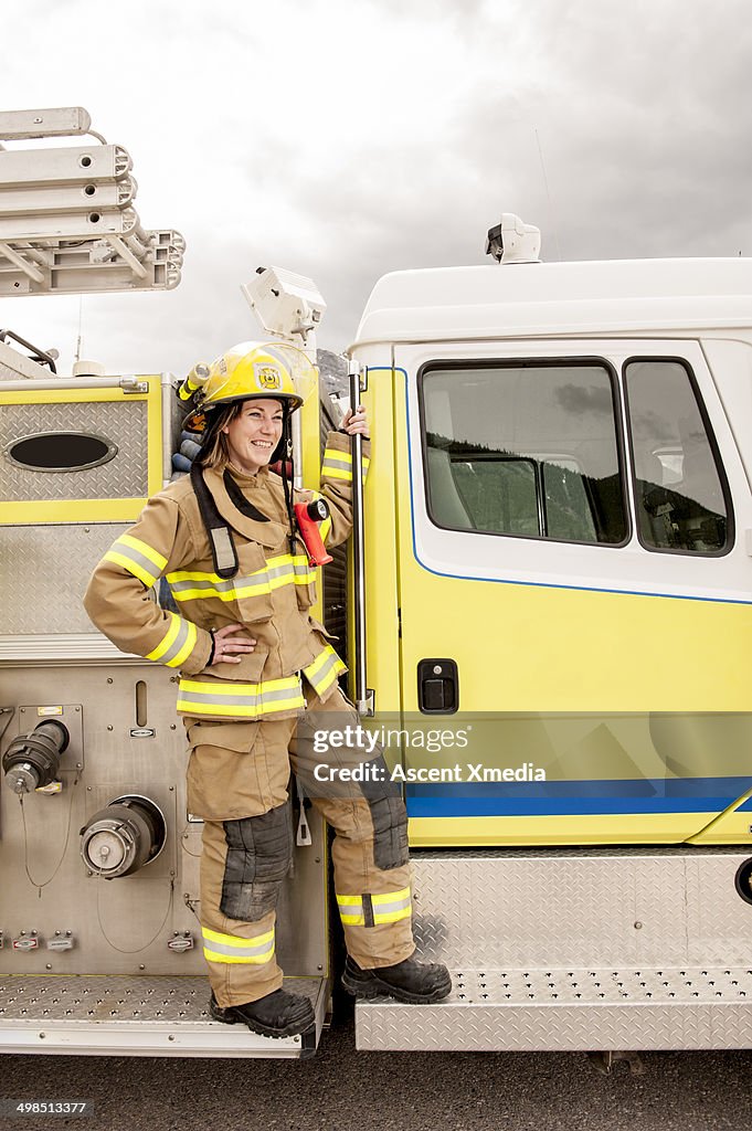 Emergency services work stands beside fire truck