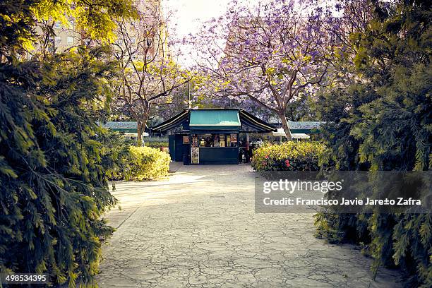 Kiosk located in the River Turia in Valencia surrounded by greenery.