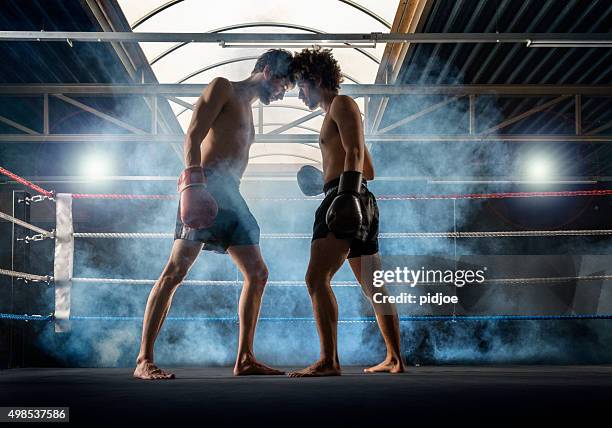 two men at the start  of thai boxing - muaythai boxing stock pictures, royalty-free photos & images