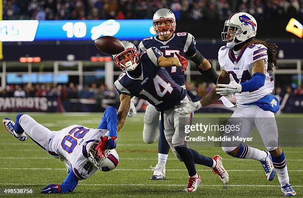 Stephon Gilmore of the Buffalo Bills intercepts a pass intended for Chris Harper of the New England Patriots during the fourth quarter at Gillette...