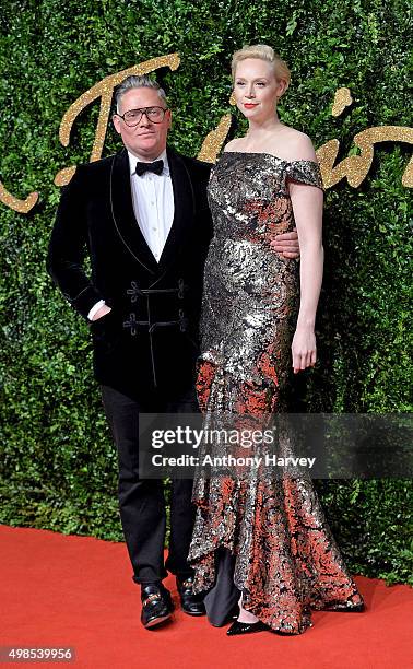 Giles Deacon and Gwendoline Christie attend the British Fashion Awards 2015 at London Coliseum on November 23, 2015 in London, England.