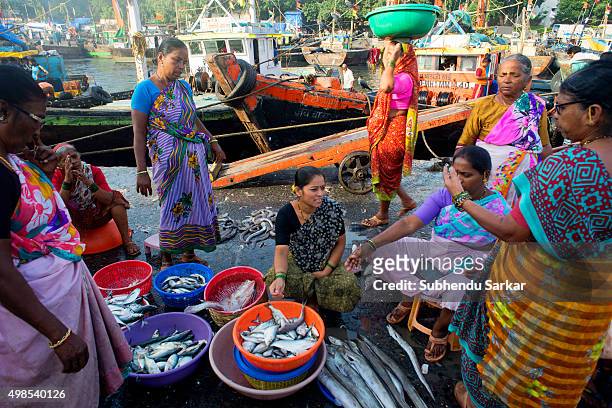 Women trade in a wide variety of fish at Sassoon Docks in Colba, South Mumbai. The Sassoon Docks is one of the oldest docks in Mumbai. It is the...