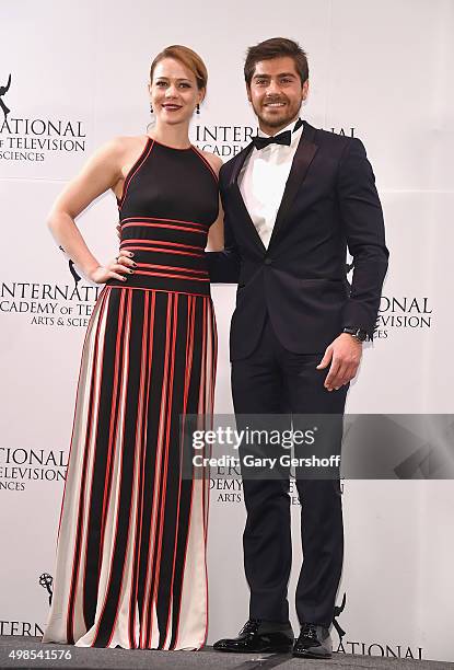 Presenters Leandra Leal and Lourenco Ortigao pose for pictures during the 43rd International Emmy Awards press room reception on November 23, 2015 in...