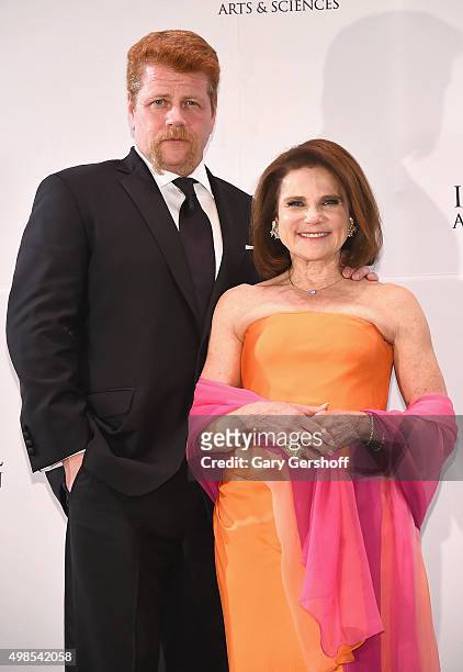 Presenters, actors Michael Cudlitz and Tovah Feldshuh pose for pictures during the 43rd International Emmy Awards press room reception on November...