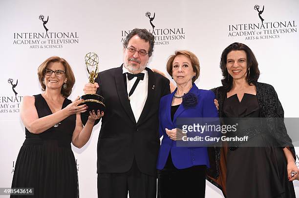 Award winners for Best Comedy, 'Doce De Mae' writer Ana Luiza Azevedo, producer Jorge Furtado and actress Fernanda Montenegro pose for pictures...