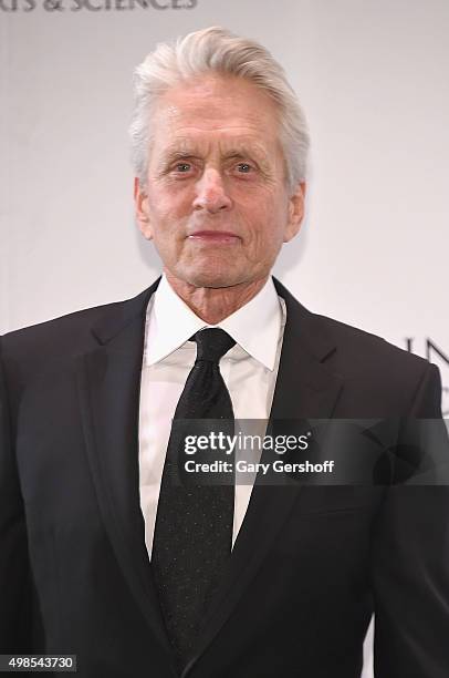 Presenter, actor Michael Douglas poses for pictures during the 43rd International Emmy Awards press room reception on November 23, 2015 in New York...