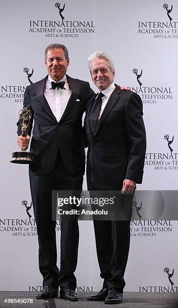 Special Directorate Award Recipient, Chairman & CEO, HBO, Richard Plepler and presenter, actor Michael Douglas pose for pictures during the 43rd...