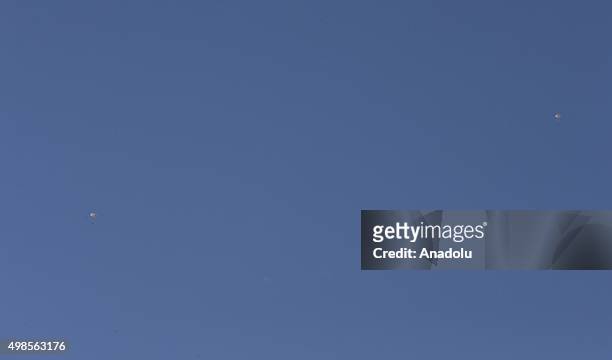 Russian pilot parachutes out of a warplane which went down in Syria's northwestern Turkmen town of Bayirbucak near Turkeys border on November 24,...