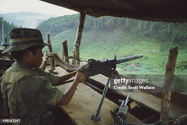 Soldiers of the Guatemalan Army using a machine gun in El Quiché, Guatemala, 1983.