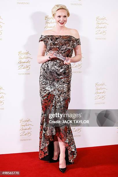 British actress Gwendoline Christie poses for pictures with her "Style" award during the British Fashion Awards 2015 in London on November 23, 2015....