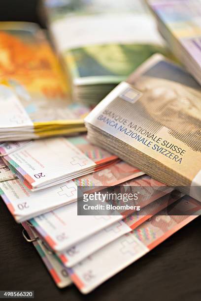Swiss Franc banknotes sit in the office of a bank in this arranged photograph in Zurich, Switzerland, on Friday, Nov. 20, 2015. The franc is still...