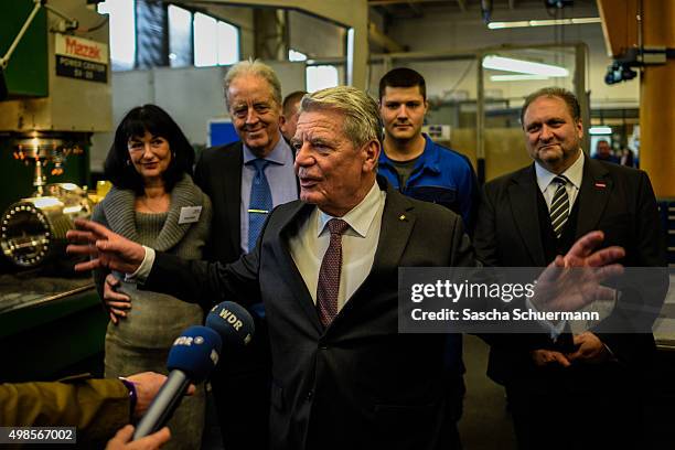 German President Joachim Gauck meets trainees at a job training facility at W. Eubel GmbH machine manufacturer on November 24, 2015 in Cologne,...