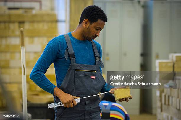 Students with an immigrant background works as a bricklayer at the Vocational training center of the Chamber of Crafts on November 24, 2015 in...