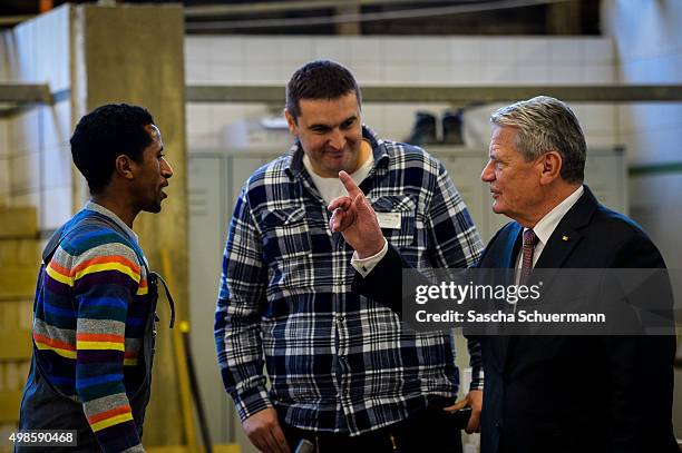 German President Joachim Gauck meets trainees and teacher at a the Vocational training center of the Chamber of Crafts on November 24, 2015 in...