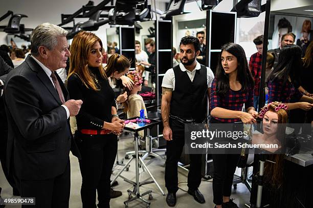 German President Joachim Gauck meets a Turkish descent teacher at a the Vocational training center of the Chamber of Crafts on November 24, 2015 in...