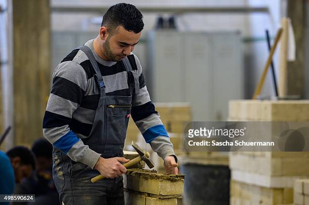 Students with an immigrant background working as a bricklayer at the Vocational training center of the Chamber of Crafts on November 24, 2015 in...