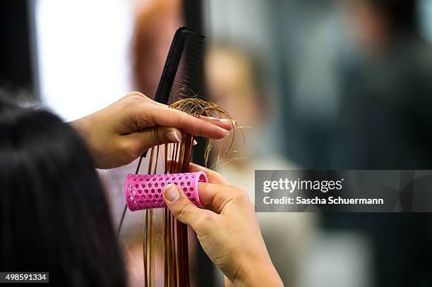 Students with an immigrant background working as a hairdresser with a dummy at the Vocational training center of the Chamber of Crafts on November...