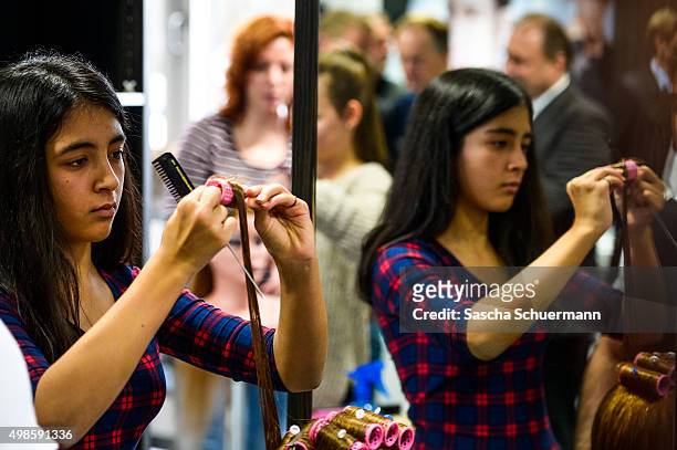 Students with an immigrant background working as a hairdresser with a dummy at the Vocational training center of the Chamber of Crafts on November...