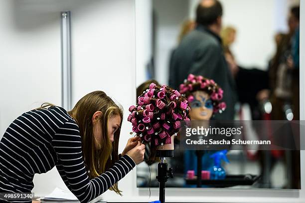 Student working as a hairdresser with a dummy at the Vocational training center of the Chamber of Crafts on November 24, 2015 in Cologne, Germany....