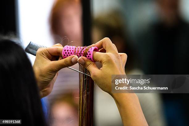 Students with an immigrant background working as a hairdresser with a dummy at the Vocational training center of the Chamber of Crafts on November...