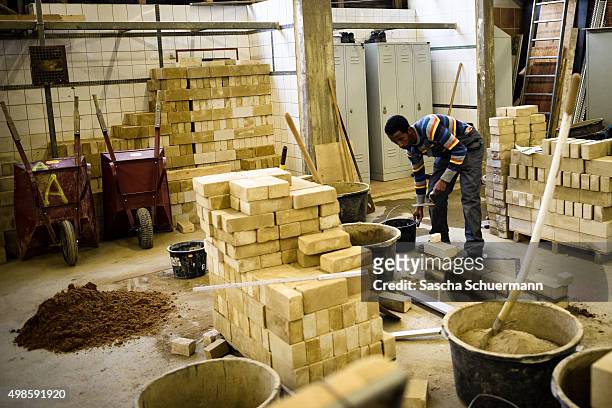 Student with an immigrant background working as a bricklayer at the Vocational training center of the Chamber of Crafts on November 24, 2015 in...