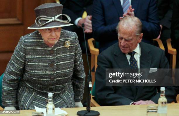 Britain's Queen Elizabeth II and her husband Britain's Prince Philip, Duke of Edinburgh attend the inauguration ceremony of the tenth General Synod...