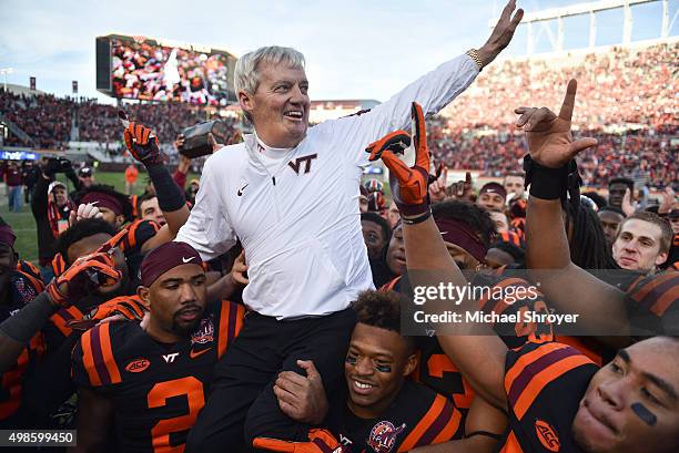 Head coach of the Virginia Tech Hokies Frank Beamer is carried off the field following the game against the North Carolina Tar Heels on November 21,...