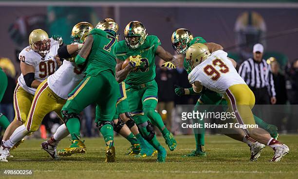 Josh Adams of the Notre Dame Fighting Irish runs with the ball against the Boston College Eagles at Fenway Park during the "Shamrock Series" on...
