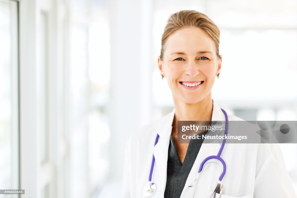 Smiling Female Doctor In Hospital
