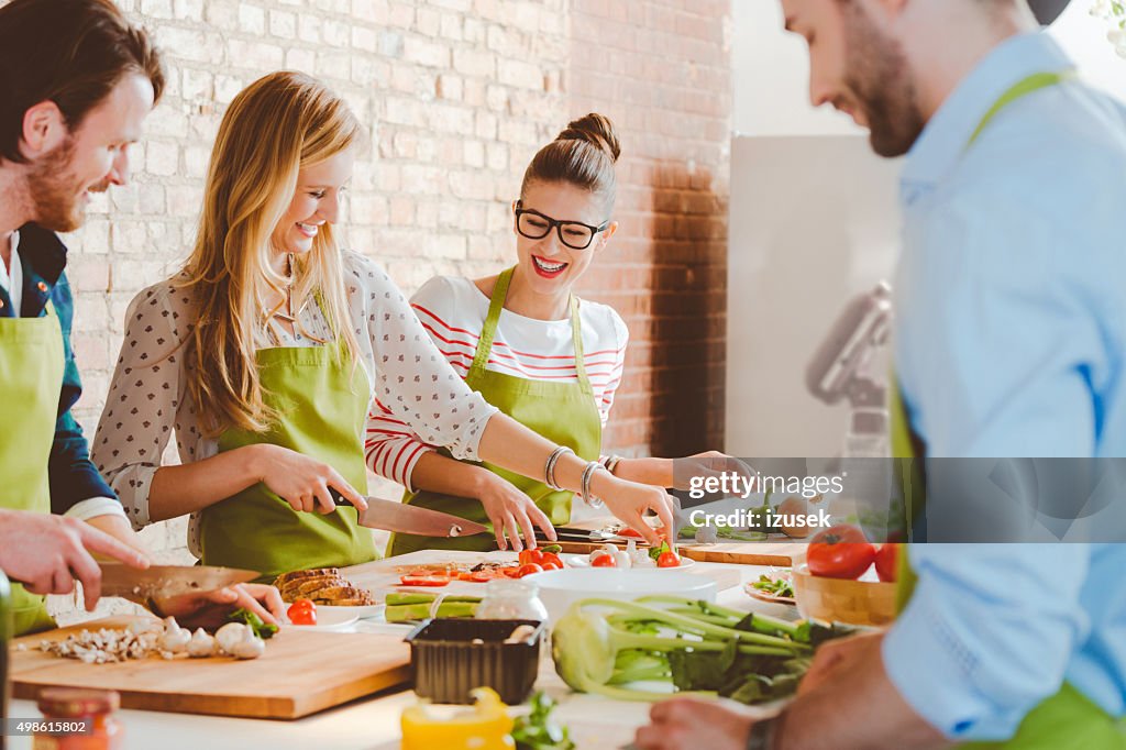 Four people taking part in cooking class