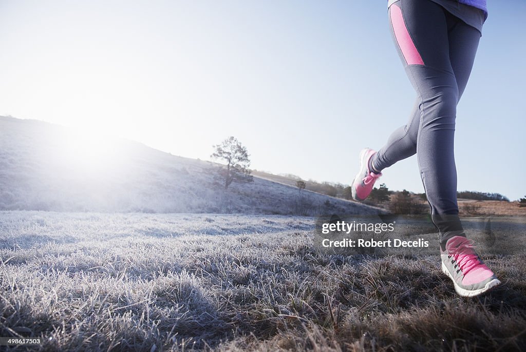 Female runners legs coming towards camera