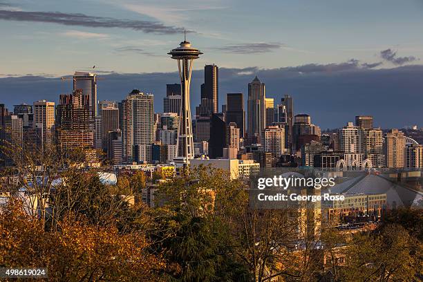 The sun sets on the Space Needle and downtown skyline as viewed from Queen Anne Hill on November 4 in Seattle, Washington. Seattle, located in King...