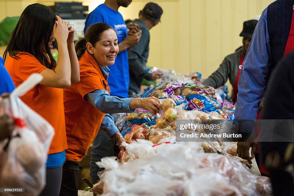 Cardinal Dolan Helps Distribute Thanksgiving Meals In Harlem