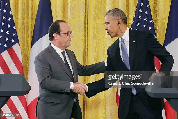 French President Francois Hollande and U.S. President Barack Obama shake hands during a joint news conference at the White House November 24, 2015 in...
