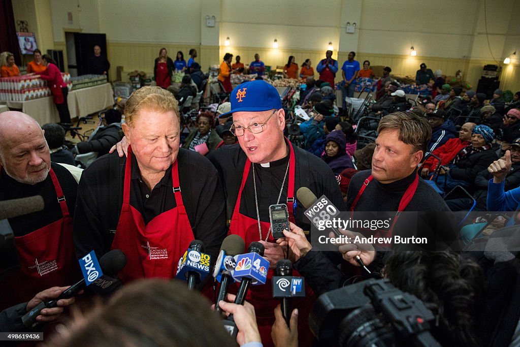 Cardinal Dolan Helps Distribute Thanksgiving Meals In Harlem