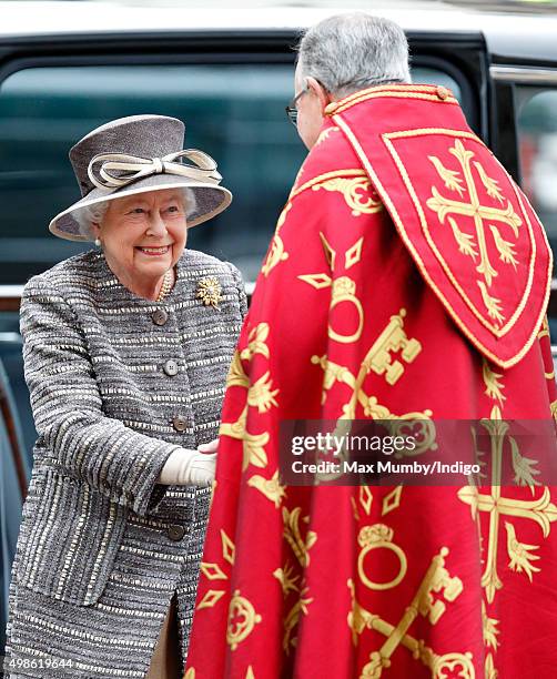 Queen Elizabeth II is greeted by The Very Reverend Dr John Hall, Dean of Westminster as she attends a service to mark the Inauguration of the Tenth...
