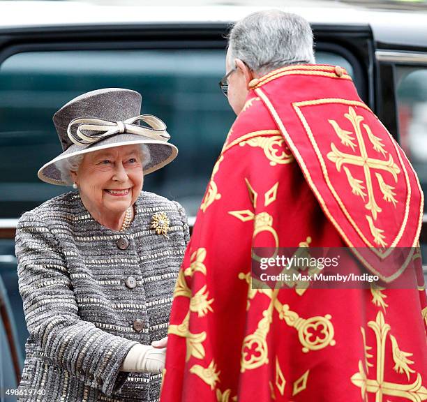 Queen Elizabeth II is greeted by The Very Reverend Dr John Hall, Dean of Westminster as she attends a service to mark the Inauguration of the Tenth...