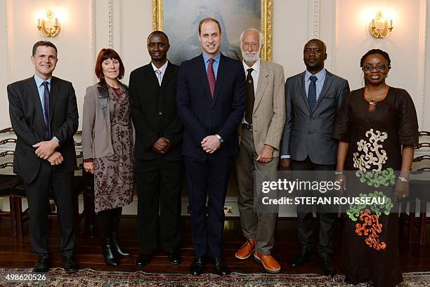 Britain's Prince William, Duke of Cambridge poses for pictures with Tusk Conservation Awards finalists Dr Emmanuel de Merode, Dr Margaret Jacobson,...