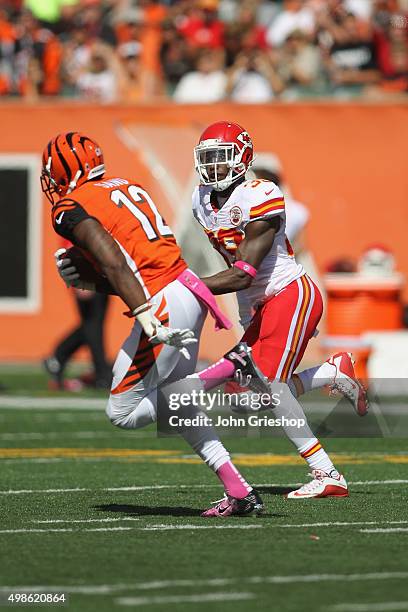 Mohamed Sanu of the Cincinnati Bengals runs the football upfield against Husain Abdullah of the Kansas City Chiefs during their game at Paul Brown...