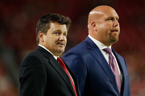 President Michael J. Bidwill of the Arizona Cardinals and general manager Steve Keim watch warm ups before the NFL game against the Cincinnati...