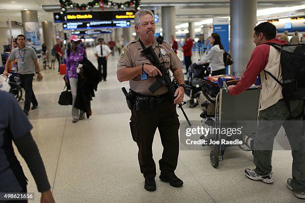 Dan Causey, from the Miami Dade police department airport district, patrols the Miami International Airport on November 24, 2015 in Miami, Florida....