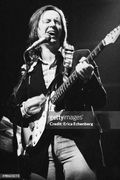 Andy Fairweather Low performs on stage at the New Victoria Theatre, London, 1976.
