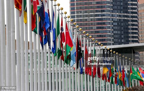 Country flags are seen in front of the United Nations Headquarters in New York, United States on November 24, 2015.