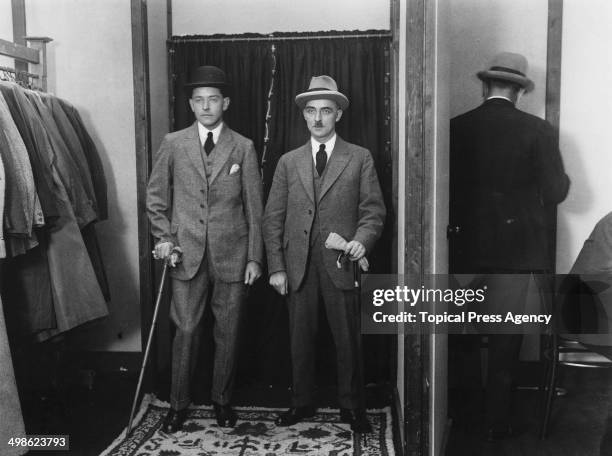 Two men modelling standard suits at a clothing exhibition, March 1921.