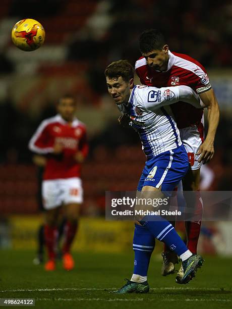 Tom Bradshaw of Walsall is challenged by Raphael Rossi-Branco of Swindon Townduring the Sky Bet League One match between Swindon Town and Walsall at...