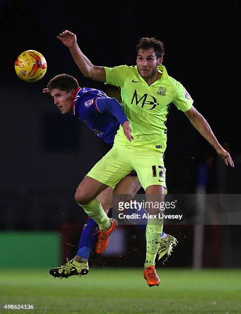 Daniel Philliskirk of Oldham Athletic is challenged to the ball by Will Atkinson of Southend United during the Sky Bet League One match between...