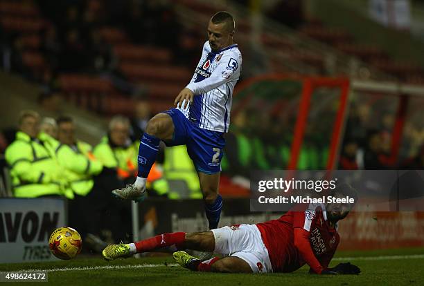 Jason Demetriou of Walsall is challenged by Yaser Kasim of Swindon Townduring the Sky Bet League One match between Swindon Town and Walsall at the...